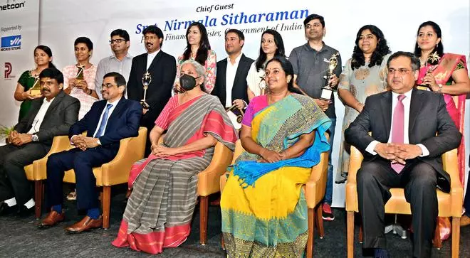 Finance Minister Nirmala Sitharaman with recipients of the Startup Dhruv Award presented by the Startups Academy in Coimbatore on Monday. Vanathi Srinivasan, BJP MLA (Coimbatore South) and Sanjay Jayavarthanavelu (sitting right), Chairman and Managing Director, Lakshmi Machine Works are also seen