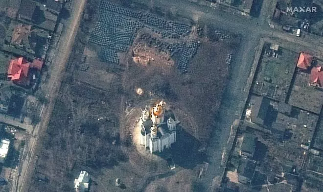 A satellite image shows the grave site with an approximately 45-foot (approximately 13,7 meters) long trench in the southwestern section of the area near the Church of St. Andrew and Pyervozvannoho All Saints, in Bucha, Ukraine, March 31, 2022