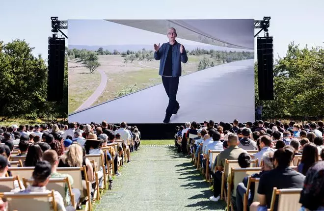 Apple CEO Tim Cook is displayed on a screen while speaking during Apple’s annual Worldwide Developers Conference in San Jose, California
