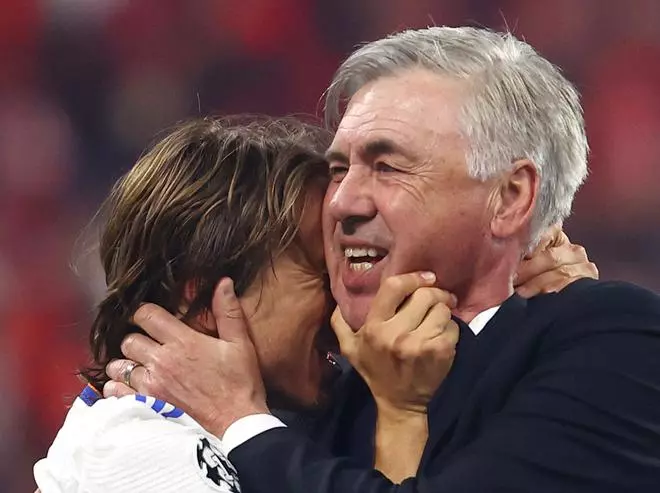 Real Madrid coach Carlo Ancelotti celebrates with Luka Modric after winning the Champions League