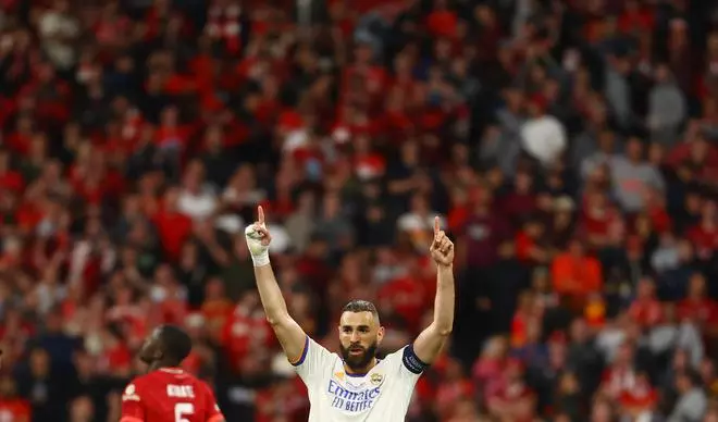 Real Madrid’s Karim Benzema celebrates after winning the Champions League