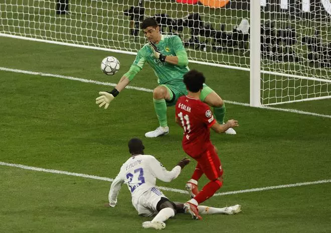 Real Madrid’s Thibaut Courtois saves a shot from Liverpool’s Mohamed Salah