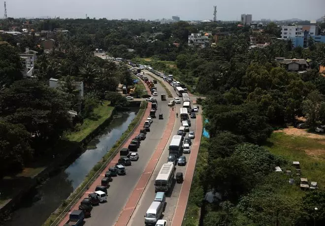 Diesel vehicles queue up in a long line to buy diesel due to a fuel shortage countrywide, amid the country’s economic crisis, in Colombo, Sri Lanka on Wednesday