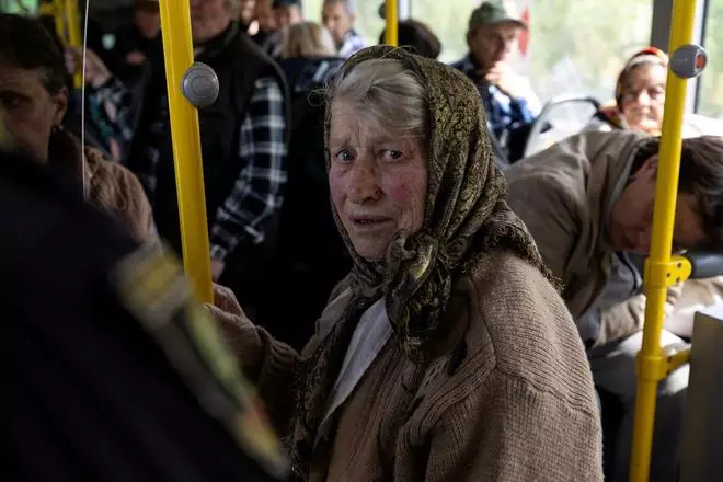 A Ukrainian woman sits on a bus after being evacuated from the frontline city of Lyman, amid Russia's invasion of Ukraine, in Slovyansk, Donetsk region