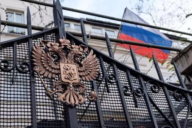 An emblem is displayed on the gate of the Russian Embassy in London, Britain. 