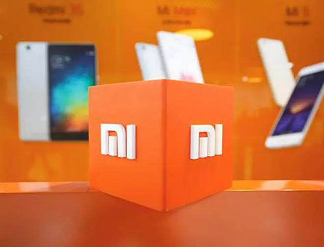 FILE PHOTO: The logo of Xiaomi is seen inside the company's office in Bengaluru, India, January 18, 2018. REUTERS/Abhishek N. Chinnappa/File Photo